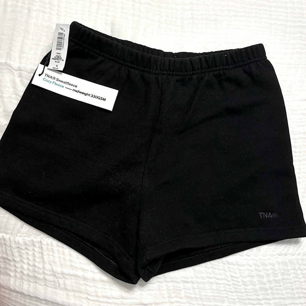 Aritzia TNA "Cozy Fleece Perfect Hi" shorts, size S in the color Black